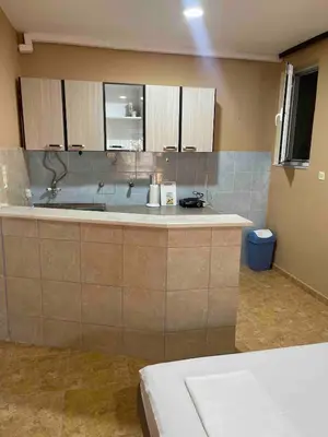 a kitchen with a sink and a counter top at Fontana Apartments 1A in Ulcinj