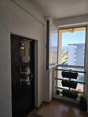 a room with a door and a large window at Apartment tuski put in Podgorica