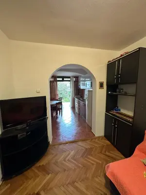 a living room with a kitchen and a dining room at Peaceful family apartment in Budva in Budva