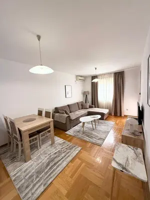 a living room with a couch and a table at Top Apartments Vuković in Podgorica