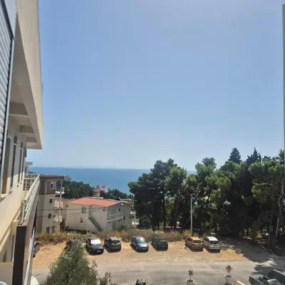 a group of cars parked in a parking lot at Apartment Suka in Ulcinj