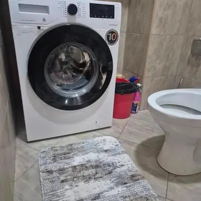 a washing machine in a bathroom with a toilet at Apartment Suka in Ulcinj