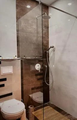a bathroom with a toilet and a glass shower at Apartman Bulevar in Ulcinj