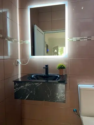 a bathroom with a sink and a mirror at Montebello Inn apartments in Ulcinj