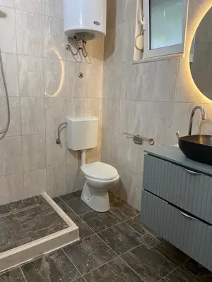 a bathroom with a toilet and a sink at Montebello Inn apartments in Ulcinj