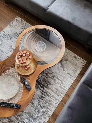 a wooden table with a glass plate on top of a table at Apartman Bulevar in Ulcinj