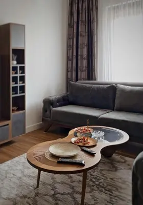 a living room with a couch and a coffee table at Apartman Bulevar in Ulcinj