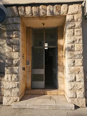 an entrance to a building with a glass door at Apartment K8 Center in Podgorica