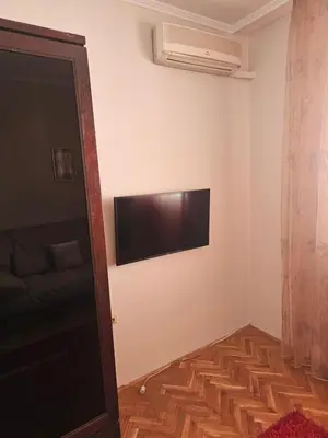 a room with a flat screen tv on the wall at Apartment K8 Center in Podgorica
