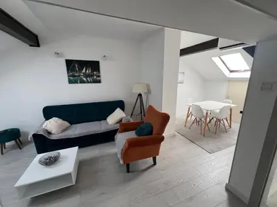 a living room with a couch and a table at Downtown Nest Podgorica in Podgorica
