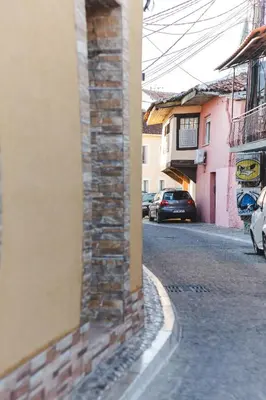 a street with cars parked on the side of a building at Stara Varos in Podgorica