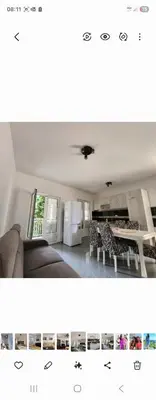 a living room with a couch and a kitchen at Ana in Becici