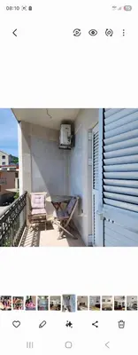 a view of a balcony with a chair and a table at Ana in Becici