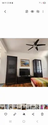 a picture of a bedroom with a ceiling fan at Ana in Becici