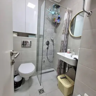 a bathroom with a shower and a toilet and a sink at Manjastan in Podgorica