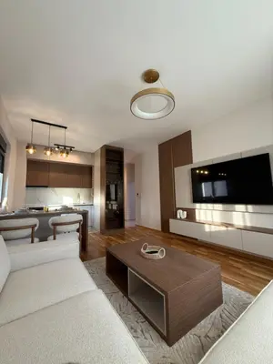 a living room with a couch and a table at Diamond H in Podgorica
