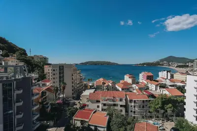 a view of a city and the ocean at Penthouse with Sea view Rafailovici in Budva