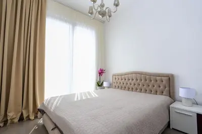 a bedroom with a bed and a large window at Luxury Horizon Penthouse Budva in Becici