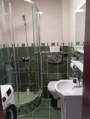 a bathroom with a shower and a toilet and a sink at Ardea apart in Budva