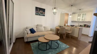a living room with a couch and a table at Galeb Family Apartments in Budva