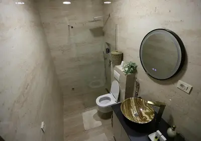 a bathroom with a sink and a toilet and a mirror at Stay Point Jerry - Podgorica City Apartment in Podgorica