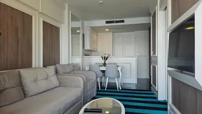 a living room with a couch and a table at Azure Coast Residence Rafailovici -Seaside Living Apartments in Becici