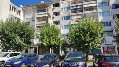 a group of cars parked in front of a building at Parkview Bar in Bar
