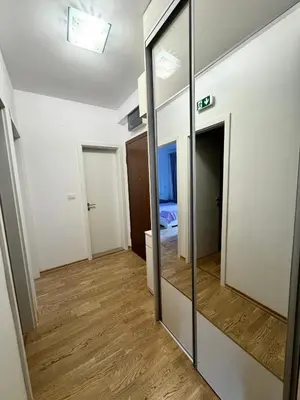 a mirror in a room with a bedroom at Apartment Central Budva in Budva