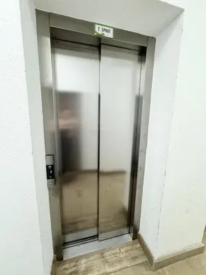 a elevator with a glass door in a building at Apartment Central Budva in Budva