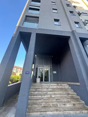 a building with stairs leading up to a door at Apartment Central Budva in Budva