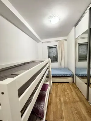 a small bedroom with a bunk bed and a bunk bed at Apartment Central Budva in Budva