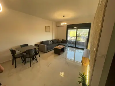 a living room with a couch and a table at Apartman Celuga in Bar