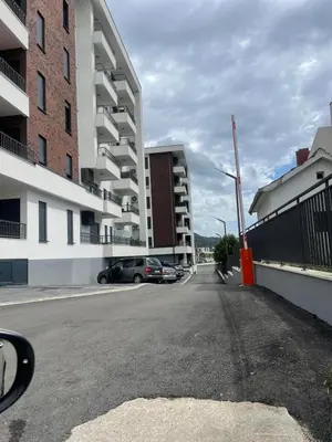 a car parked on the side of a street with buildings at Apartman Celuga in Bar