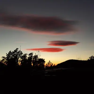 a sunset with a group of clouds in the sky at villa lavander hill in Budva