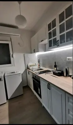 a kitchen with a sink and a counter top at Apartman Budva in Budva