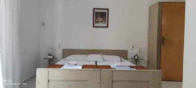 a bedroom with a bed with two towels on it at House Irena in Budva