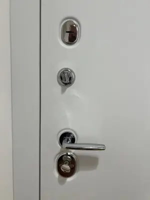 a white door with two knobs on it at Luxury Apartment SOHO CITY in Bar