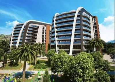 two tall buildings with palm trees in a park at Luxury Apartment SOHO CITY in Bar