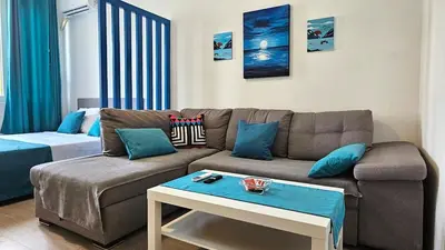 a living room with a couch and a table at Zero Distance Studio in Podgorica