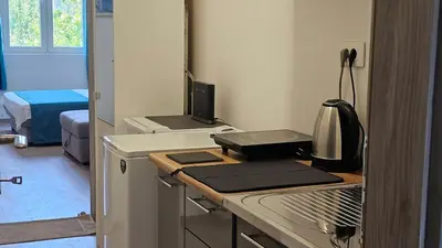 a kitchen with a counter top with a microwave at Zero Distance Studio in Podgorica