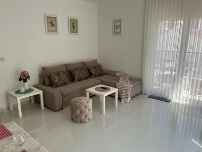 a living room with a couch and a table at Hidden Gem, Budva in Budva