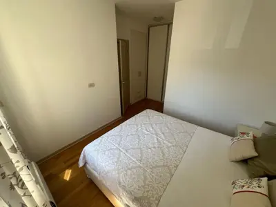 a small bedroom with a bed in a room at Hidden Gem, Budva in Budva
