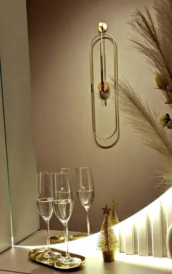 a group of wine glasses on a table with a light at Kaltak Luxury Stay in Bar