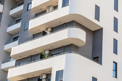an apartment building with people on the balconies at Kaltak Luxury Stay in Bar