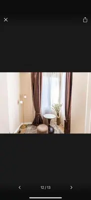 a living room with a table and a window at Little star in Ulcinj
