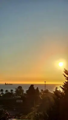 a sunset over the ocean with the sun in the sky at LIMONCELLO Apartment in Bar
