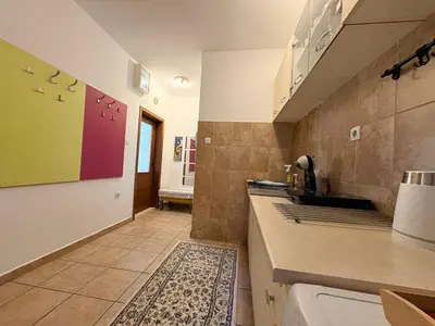 a kitchen with a sink and a counter at Apartman Sunce in Podgorica