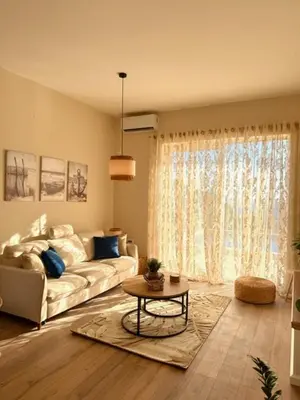 a living room with a couch and a table at Villa Lotos in Budva