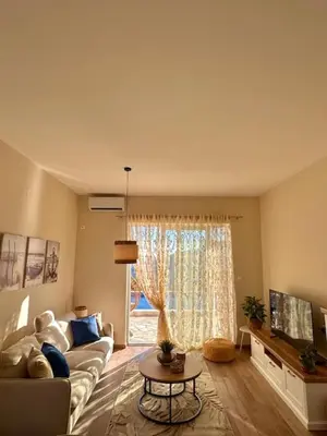 a living room with a couch and a window at Villa Lotos in Budva