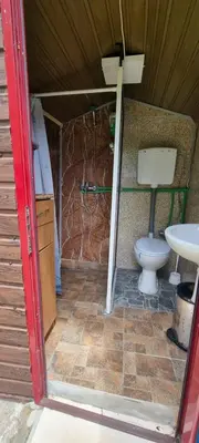 a bathroom with a toilet and a sink at Livari CAMPING in Livari